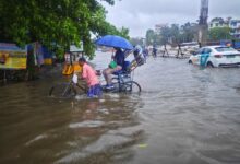 A busy street in Kolkata waterlogged due to heavy monsoon rains.